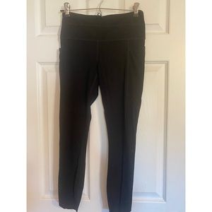 Athleta laser cut black leggings with pockets size small